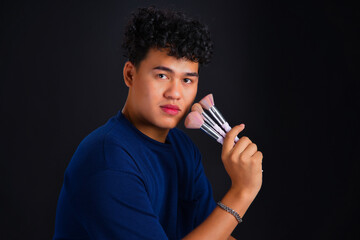 Asian Male make-up artist.