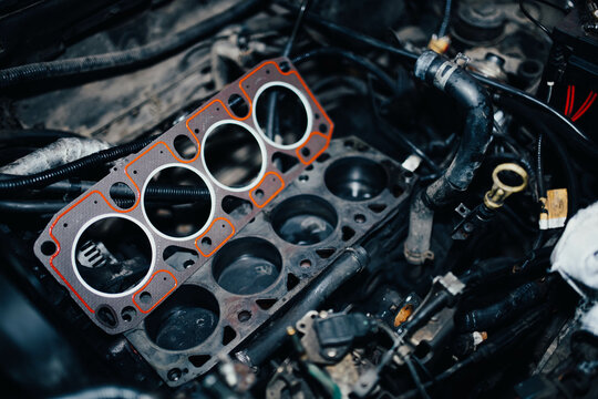 replacement of the cylinder head gasket in the car engine.