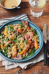 Roasted pepper salad with bacon, quinoa and wild rocket