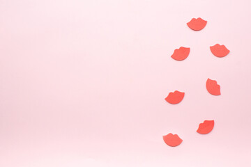 Red lips pattern on pastel pink background. Retro vintage 80s and 90s style. Beauty and fashion makeup idea.