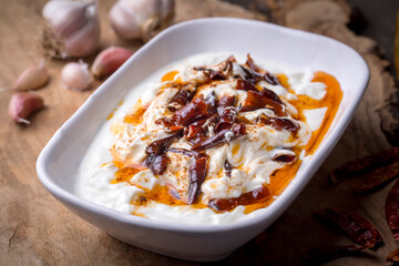 Traditional Turkish and Greek Meze with chili peppers. Turkish Appetizer Atom with yogurt. Turkish atom meze