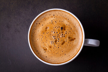 Cup of coffee on black table
