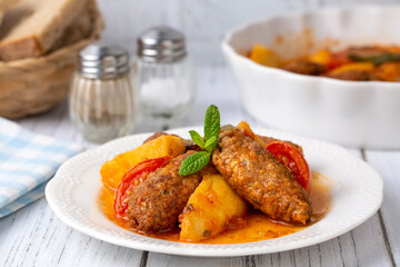 Traditional Homemade Turkish Food Kofte - Kofta with Tomato Sauce and Potatoes. (Turkish name; Izmir kofte)