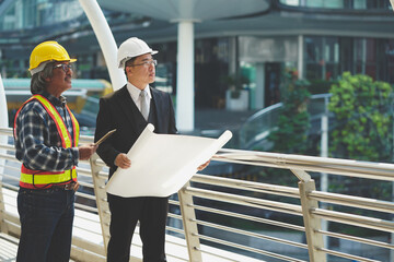 engineer and business check work ,Investment and business success.