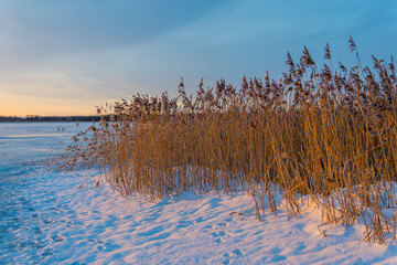 Panoramic view of the stunning frozen Lake Maardu near Tallinn, Estonia at sunrise