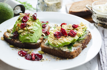 Healthy avocado toasts for breakfast or lunch with rye bread