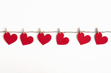  A garland of red hearts, a symbol of Valentine's Day. White background.