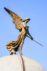A sculpure of an angel adornes the top of a memorial to the dead at La recoleta Cemetery in Buenos...