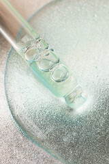 Top view of pipette in cosmetics gel.Vertical photography.