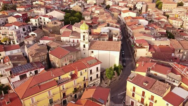 Aerial forward view over typical southern old town. Guardia Sanframondi. Italy. Slow motion