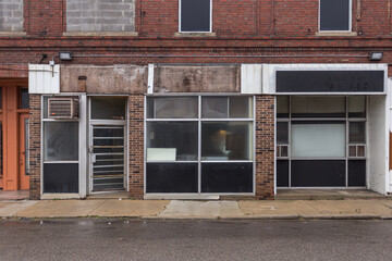Multiple empty storefronts on old street in a forgotten neighborhood