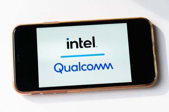 Intel and Qualcomm logos on smartphone screen.Intel will make Qualcomm chips in new foundry deal. Los Angeles, California, USA - February 2022