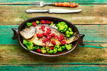 Appetizing gilthead fish in berry sauce.