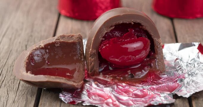 Cherry filled chocolate candy with candies packed in red foil paper