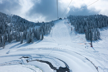 Poiana Brasov ski resort in Transylvania, Romania, during a beautiful winter day in Carpathian Mountains