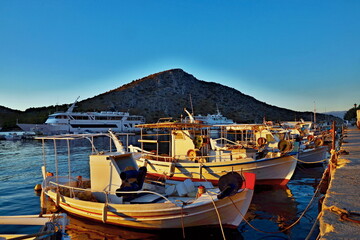 Greece-view of the sunrise in harbor in Tolo