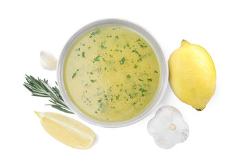 Bowl with lemon sauce and ingredients on white background, top view. Delicious salad dressing