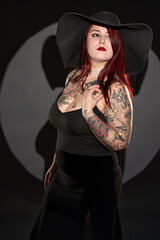 Plus size female model in black dress