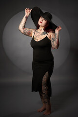 Plus size female model in black dress