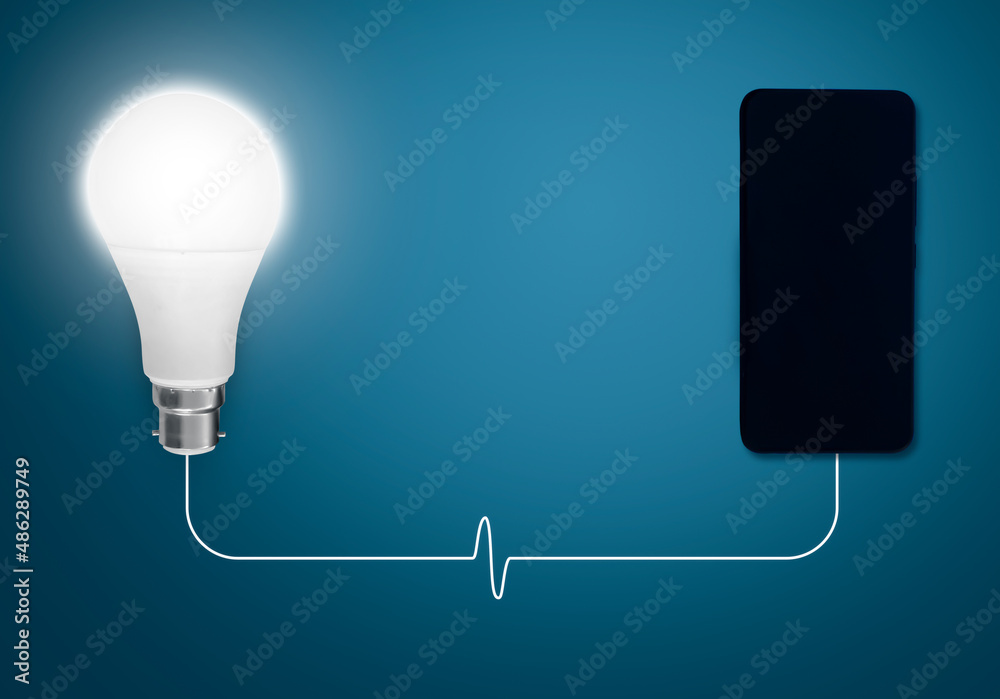 Poster idea bulb connected with mobile and transfering current through wire. abstract glowing bulb backgrou