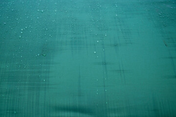 Drops of water on a water-repellent fabric during the rain, background texture