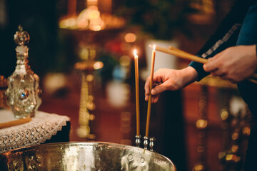 Fototapeta na wymiar praying hands with candles