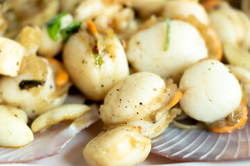 Grilled scallop cook with garlic background