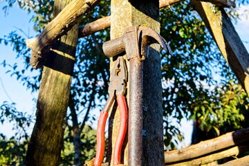 Harmer and a pair of pliers used as repair tools