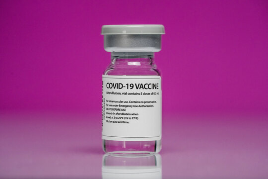 Coronavirus vaccine on pink background