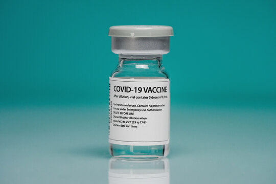 Coronavirus vaccine on blue background