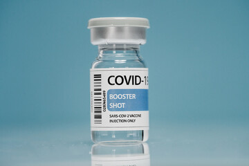 Coronavirus booster vaccine on blue background