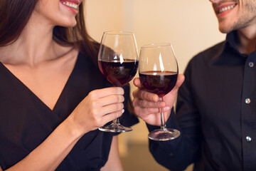 Happy woman and man drinking wine on a date