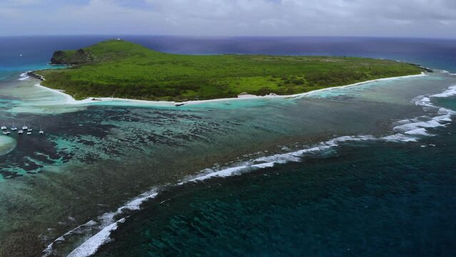 Aerial view on a bay with catamarans between Flat and Gabriel islands 