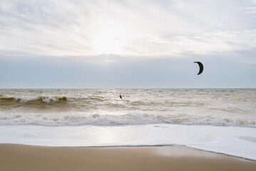 Person surfs in storm weather