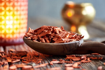 Red sandalwood on a wooden spoon, close up