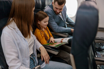 Man traveling with family on passenger airplane