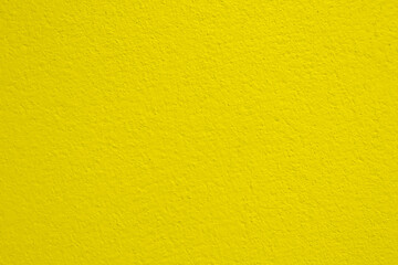 Seamless texture of yellow cement wall a rough surface, with space for text, for a background..