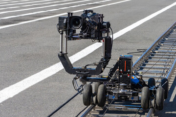 Video camera on rail carts. Specialized operator equipment. Professional video filming Concept....