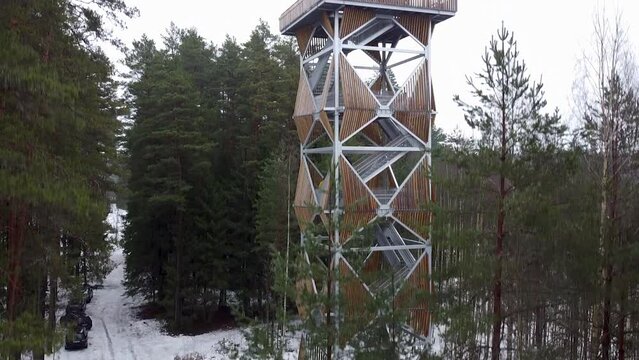 Rising aerial drone view of Valgesoo viewing tower. Recorded in Estonia during winter.