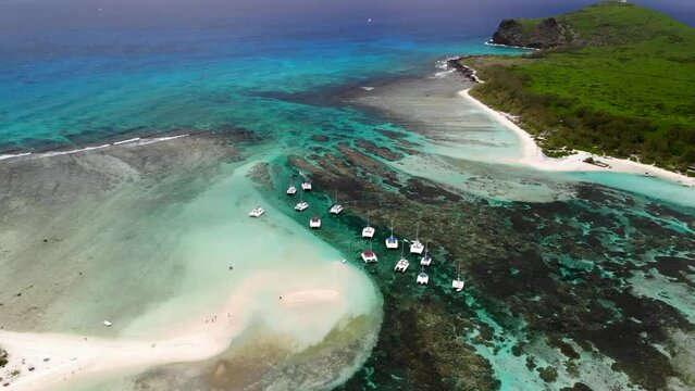 Aerial view on a bay with catamarans between Flat and Gabriel islands 
