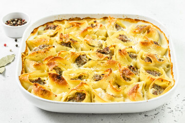 Buffalo chicken stuffed conchiglioni pasta shells. Space for text.