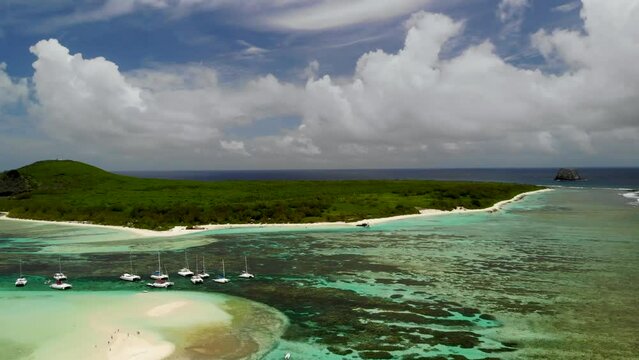 Aerial view on a bay with catamarans between Flat and Gabriel islands 