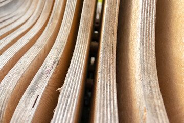 Abstract curved wooden plywood background, natural woodwork