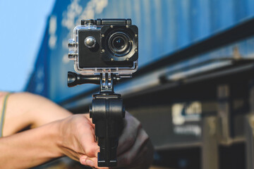 Close up, action camera in a male hand. Against the background of a railway carriage.