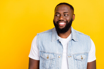 Portrait of attractive minded cheerful man thinking copy blank space isolated over bright yellow color background