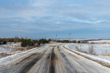 dangerous road in winter after snowfall,