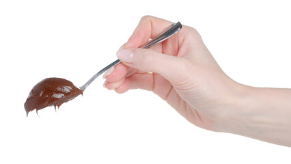 Hand holding spoon of chocolate hazelnut paste on white background isolation