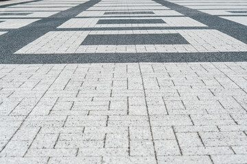 Close up, texture, background. Rectangular paving slabs from a granite crumb.