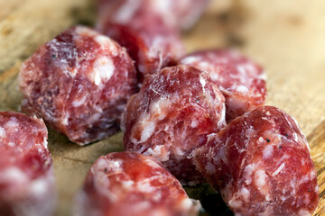 sliced sausage of dried meat with bacon