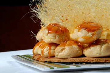 Classic scones topped with honey and garnished with traditional British sweet caramel strands
